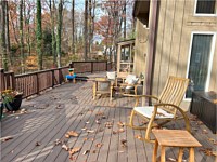 <b>TimberTech Composite deck boards in the Reserve Collection in the color of Dark Roast Trex Composite Railing and Drink Rail in the color of Vintage Lantern</b>