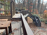 <b>TimberTech Composite deck boards in the Reserve Collection in the color of Dark Roast Trex Composite Railing and Drink Rail in the color of Vintage Lantern</b>