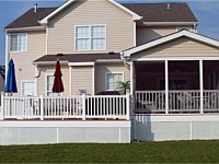 <b>Screened Porch and deck with composite deck boards and white vinyl railing. Gable style roof and a screening system using Screeneze and Super Screen Mesh. Gabled area is finished with siding. Structure is wrapped with white fascia wrap and vinyl lattice.</b>