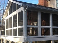 <b>Screened Porch with a gable style roof, Screeneze and Super Screen Mesh, Composite deck boards with white vinyl railing and black aluminum balusters. The entire deck is wrapped with white fascia board, and the support beams and posts are also wrapped in vinyl. </b>
