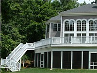 <b>Screened porch under the deck. Deck has composite deck boards and white vinyl railing. Dek Drain is used to provide for under-the-deck dry space.</b>