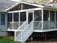 <b>Screened Porch with a gable style roof, complete with composite deck boards and white aluminum railing.  The screening system includes Screeneze and Super Screen Mesh.</b>