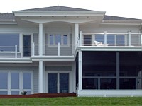 <b>Screened porch with overhead deck. The screening system includes Screeneze and Super Screen Mesh. The overhead deck has composite deck boards and cable rail attached to composite posts.</b>