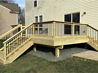 <b>Wood deck with wood railing and black aluminum balusters 1</b>
