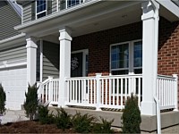 <b>Square Vinyl Columns with decorative touches and white vinyl railing attached to concrete porch flooring 1</b>
