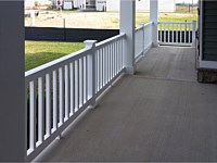 <b>View standing on the porch with square vinyl columns and white vinyl railing on concrete porch</b>