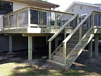 <b>Wood deck and stairs with wood railing and black aluminum balusters</b>