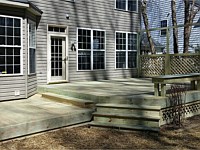 <b>2 level wood deck and stairs with built in bench and trellis.  Under the deck is wrapped in wood lattice</b>
