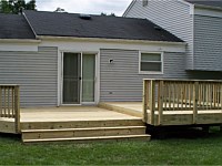 <b>2 level pressure treated wood deck with wood railing</b>