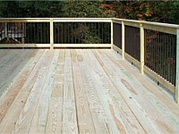 <b>Pressure treated wood deck with wood railing and black aluminum balusters 2</b>