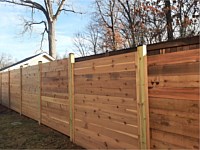 <b>6 foot Horizontal cedar stepped fencing with no spacing between the pickets with standard black post caps.</b>