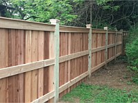<b>6' high cedar board and batten privacy fencing with 6x6 post and cedar New England post caps.</b>