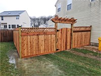<b>6' high cedar board and batten privacy fencing with 6x6 post and cedar New England post caps.</b>