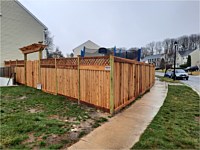 <b>Front of fence is cedar board on batten style with diagonal lattice at the top and 1x6 top and bottom fascia and new England style post caps. Side of fence is cedar board on batten style with 1x6 top and bottom fascia and new England post caps.</b>