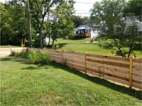 <b>42 inch high cedar horizontal semi-privacy fence with alternating 1 x 4 and 1 x 6 spaced cedar boards and Dog Ear posts</b>