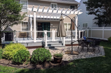 Trex Pebble Gray Decking with White Washington Vinyl Railing with Black Round Aluminum Balusters + Double Gate + White Vinyl Pergola
