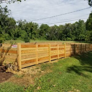 4-foot-high-Cedar-Horizontal-Fence-with-alternating-sized-boards-and-dog-ear-posts-scaled-1.jpg