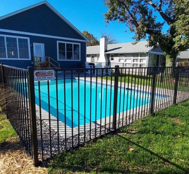 aluminum fence around a pool in the backyard