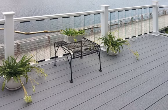glass railing on the side of a deck