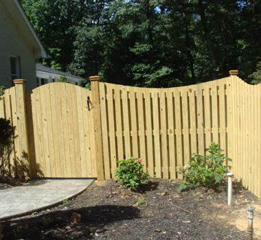 Concave Dip Board on Board Wood Privacy Fence with Arched Gate