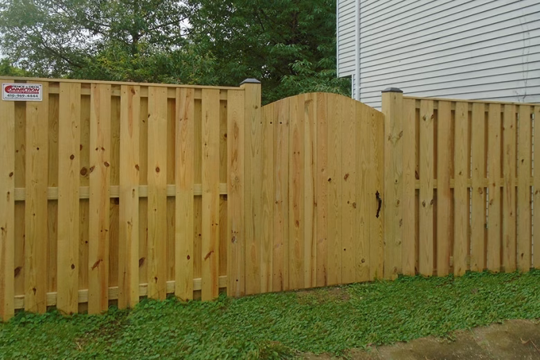 Pressure Treated Board on Board Privacy Fence with single arched gate