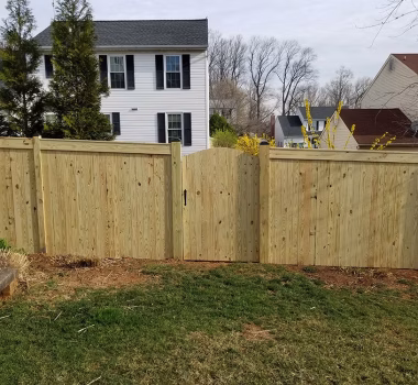 Pressure Treated Privacy Fence with Fascia and arched walk gate