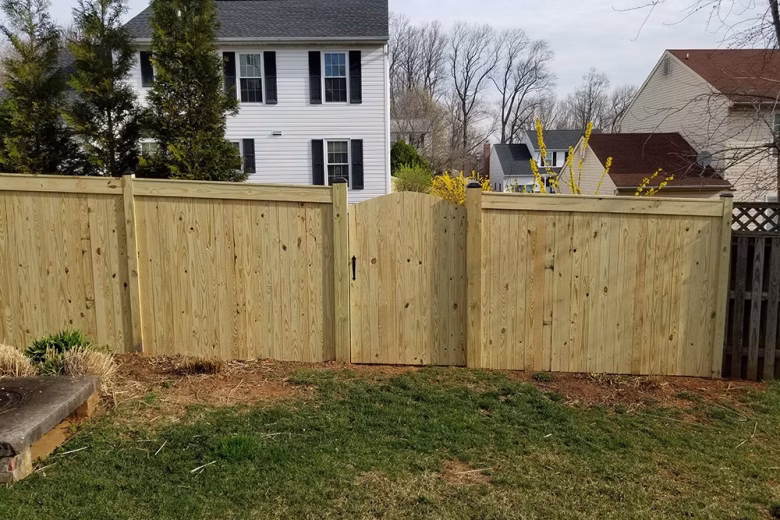 Pressure Treated Privacy Fence with Fascia and arched walk gate