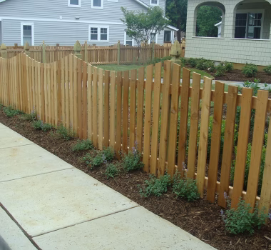 Wood Picket Fence with a Concave Dip and French Gothic Posts