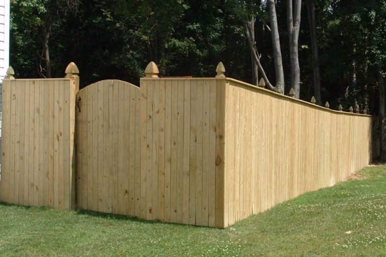 Pressure Treated Wood Vertical Board Fence With Arched Gate