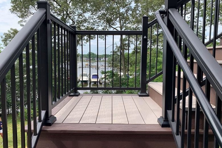 TimberTech Azek Harvest Slate Gray deck boards with Kona feature deck boards and stair risers + Black Ultralox Aluminum Railing