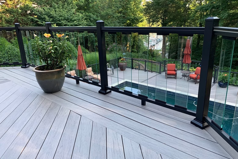 TimberTech Legacy Ashwood Composite Decking + Ultralox Aluminum Railing with Glass Picket Infills 2 Level Deck with Pool