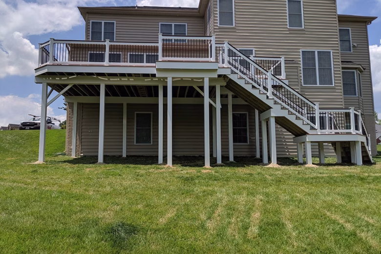 Trex Composite Decking with White Vinyl Railing with Black Aluminum Balusters White Vinyl Wrap around deck beams and support posts