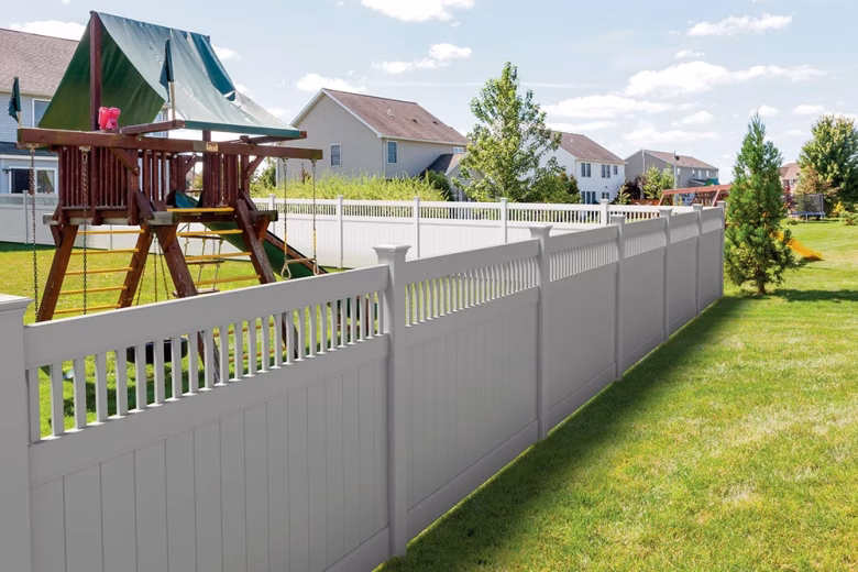 White Vinyl Privacy Fence With Closed Top Spindles