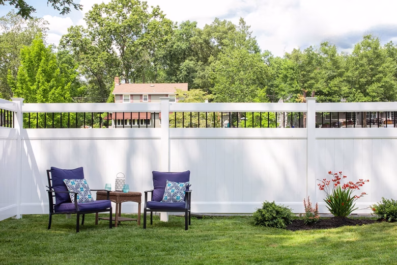 White Vinyl Privacy Fence with Round Aluminum Spindle Topper