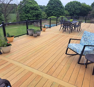 Pressure Treated wood deck with aluminum railing with glass inserts