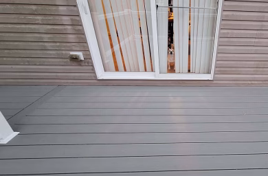 Trex Enhance decking close up with dog in window