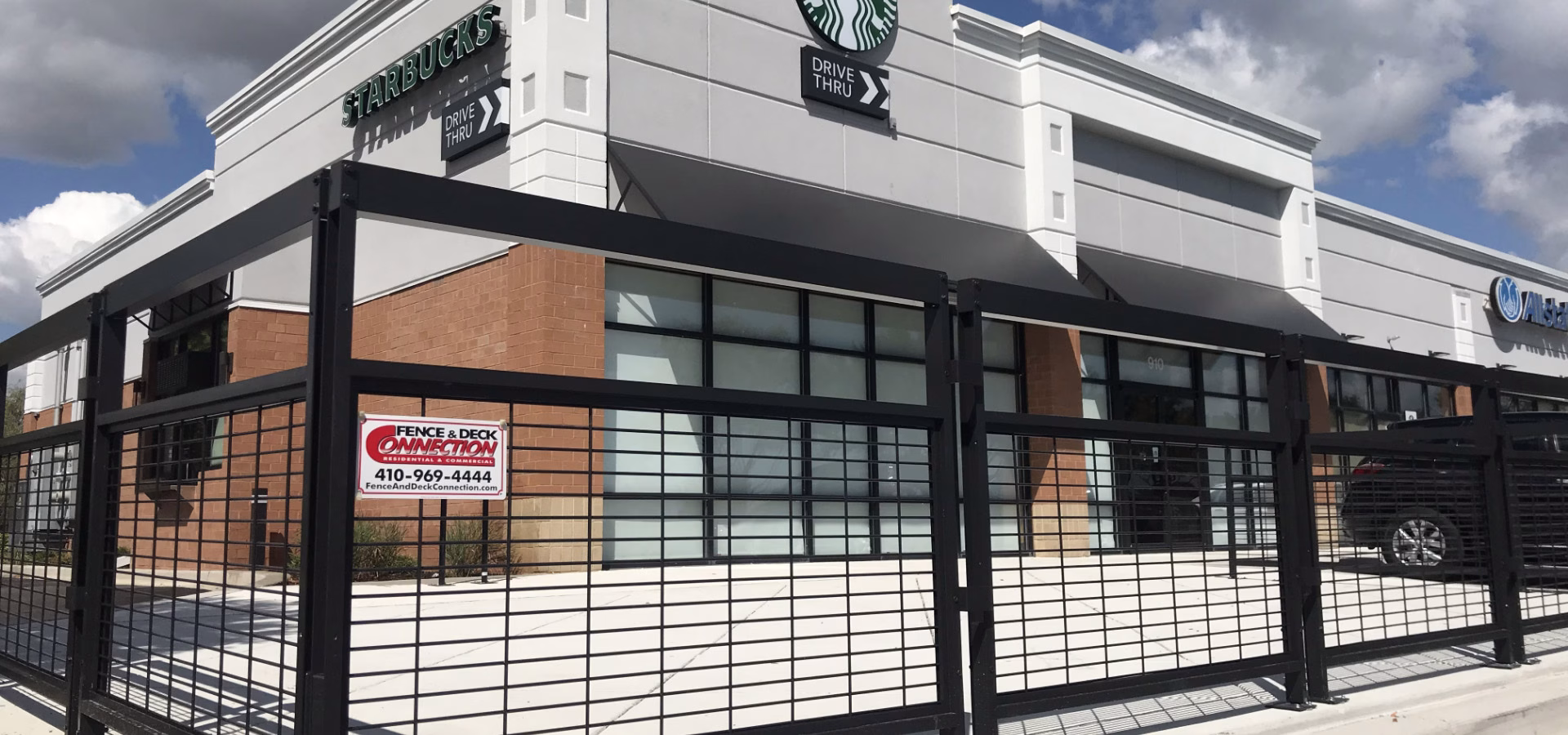 commercial fence outside a Starbucks