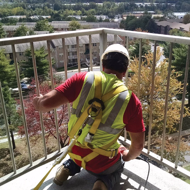 employee working on a railing