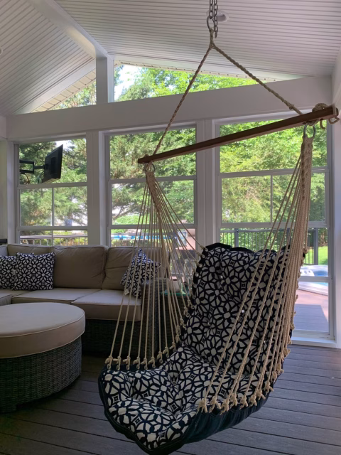 screened porch inside with hanging hammock chair