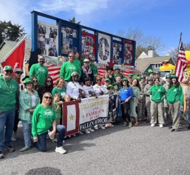group of employees at a charity event smiling
