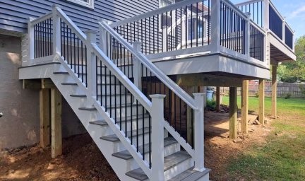 a close up of the stairs going down to the yard