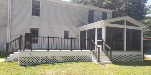 screened porch and TimberTech composite deck on the back of a house