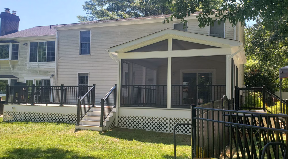 screened porch and TimberTech composite deck on the back of a house