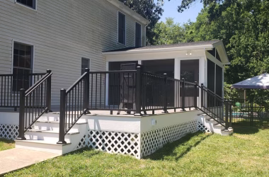 screened porch and TimberTech composite deck on the back of a house