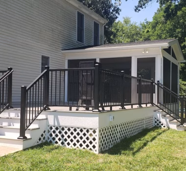 screened porch and TimberTech composite deck on the back of a house