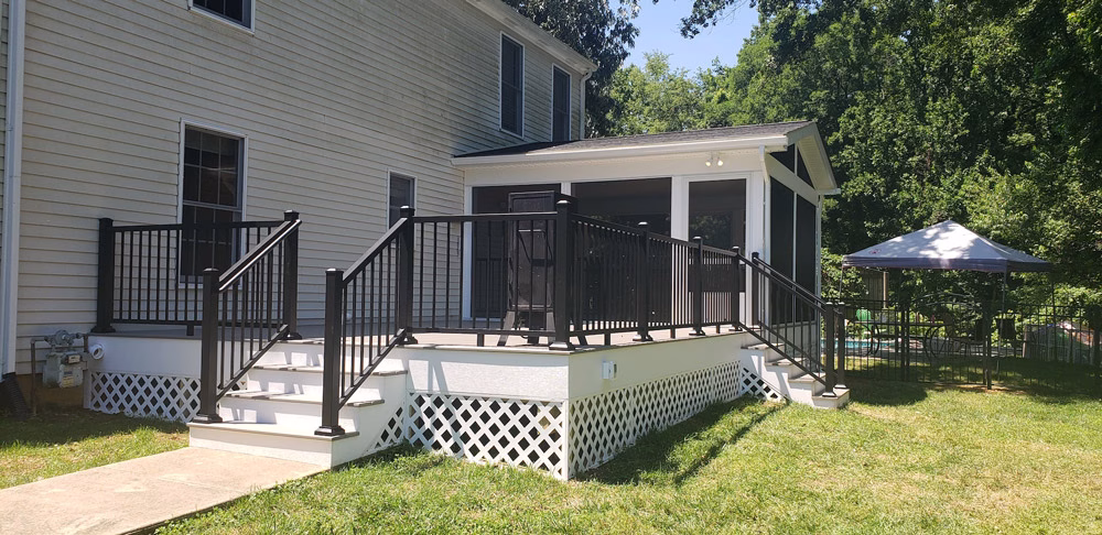 screened porch and TimberTech composite deck on the back of a house