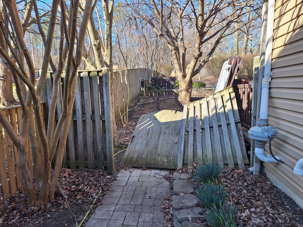 the original wood fence falling down