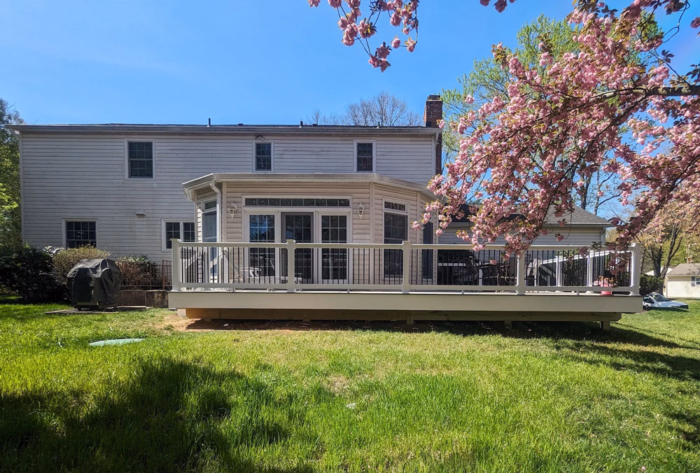 gray Timbertech deck on the back of a house