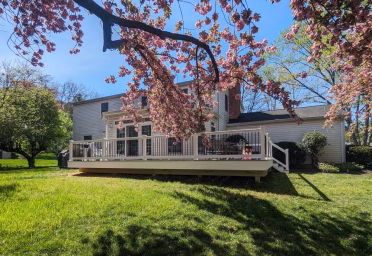 gray Timbertech deck on the back of a house