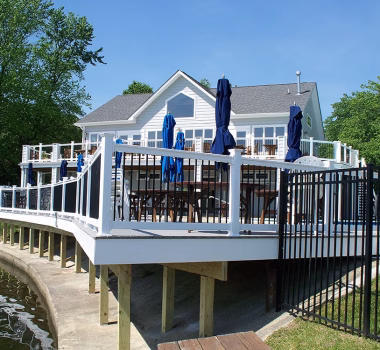 Waterfront community composite porch & deck + Perimeter Aluminum fencing